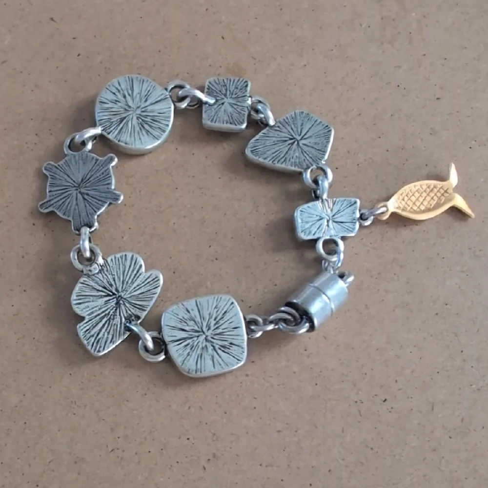 Artisan Silver and Gold Charm Bracelet